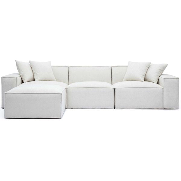 Sofa narozna o nowoczesnym konturze z harmonijnym wykonczeniem w odcieniu bieli